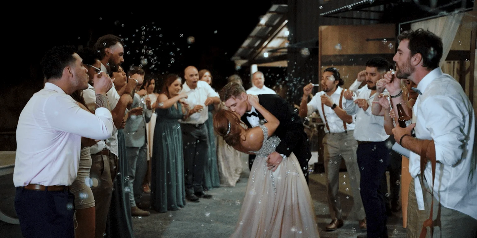 Bubbles blown during bride and groom grand exit shared with their closest friends and family