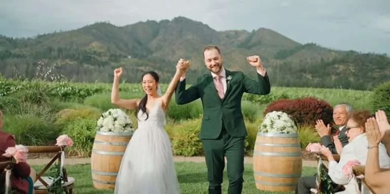 Bride and groom walking down the aisle as husband and wife