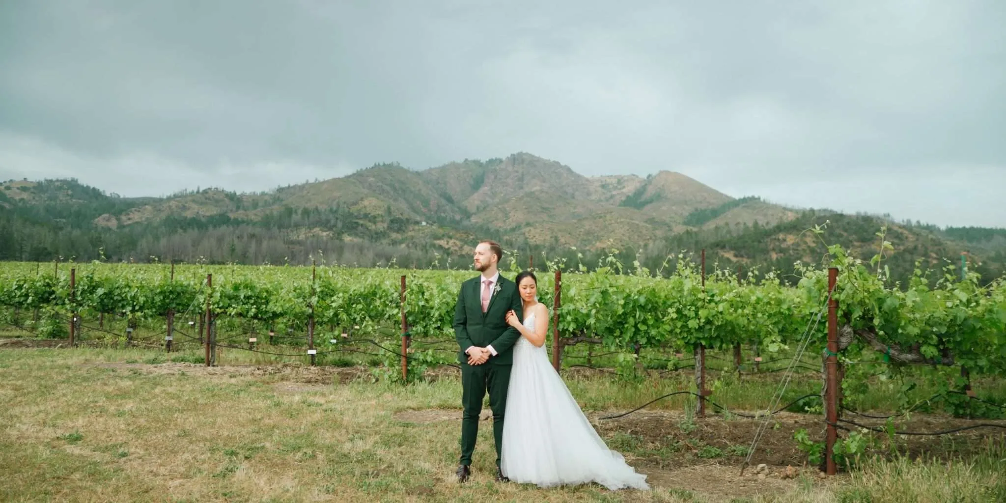 Beautiful bride and groom embracing in a loving hug